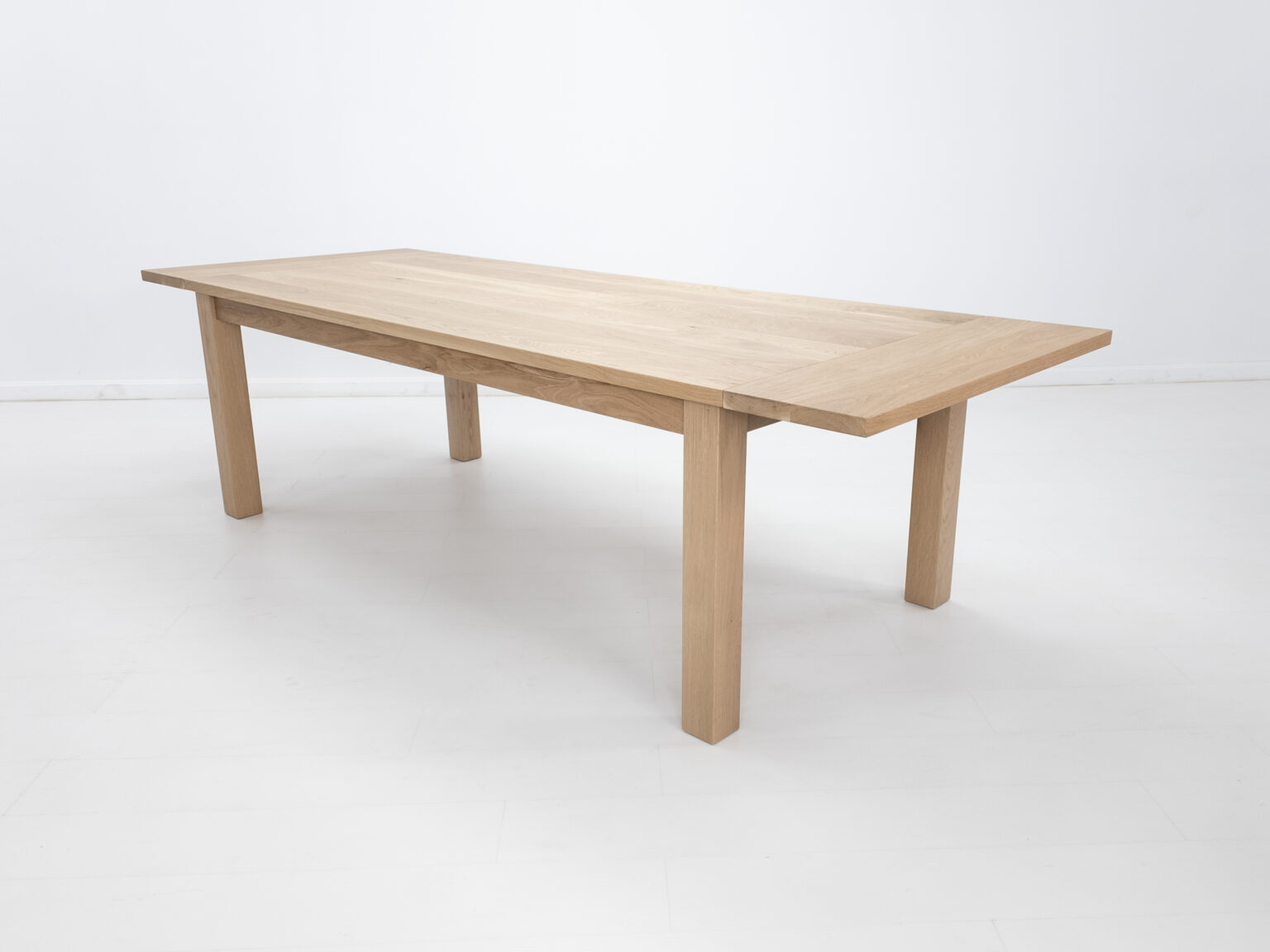 Light oak extending dining table