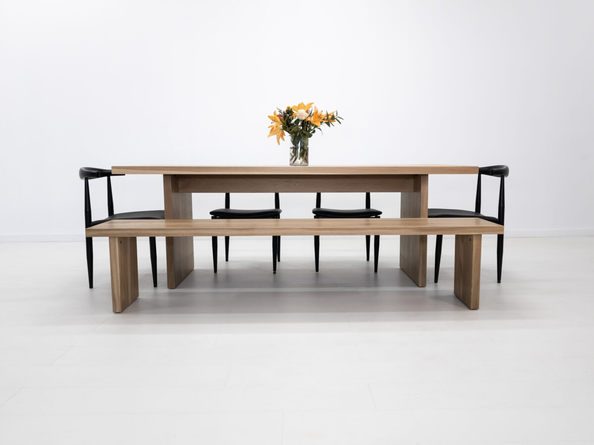 2 inch thick white oak LILY dining table with a clear matte finish and matching bench
