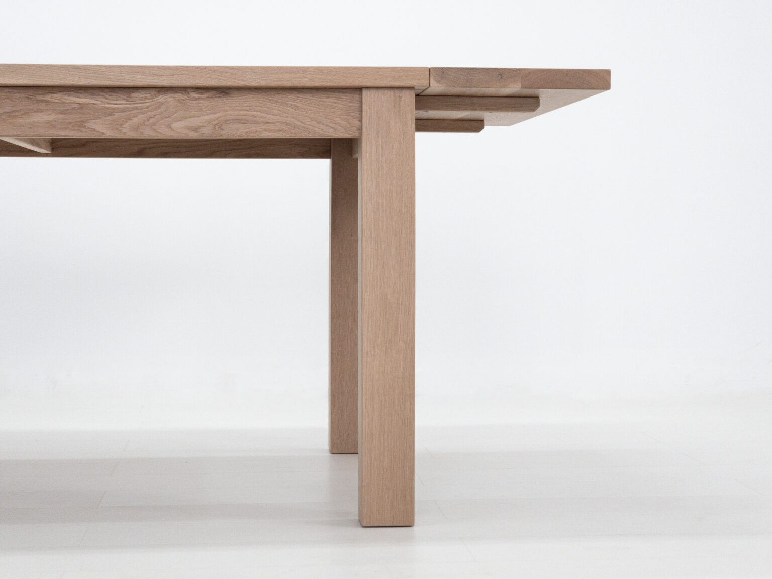 Wooden extendable dining table detail