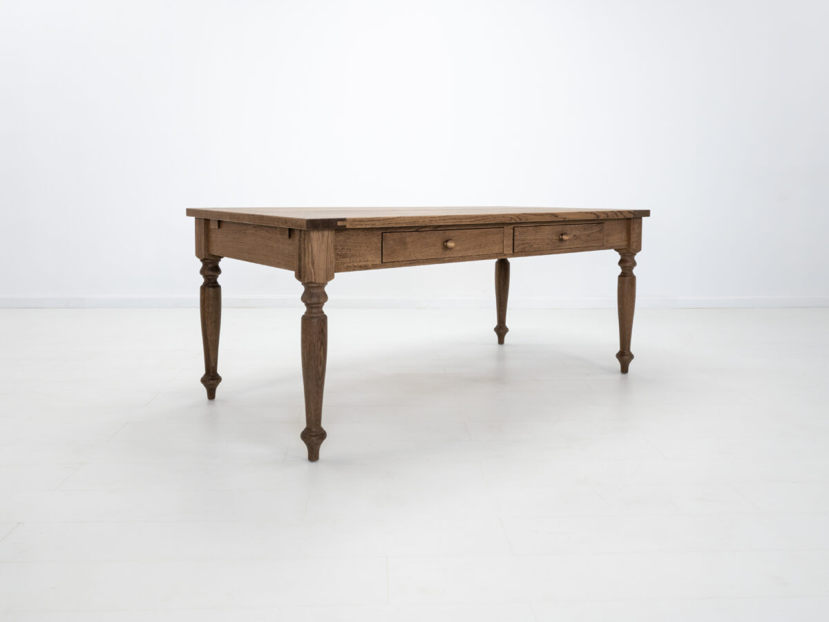 Handcrafted farmhouse table with turned legs and two drawers made from solid American white oak