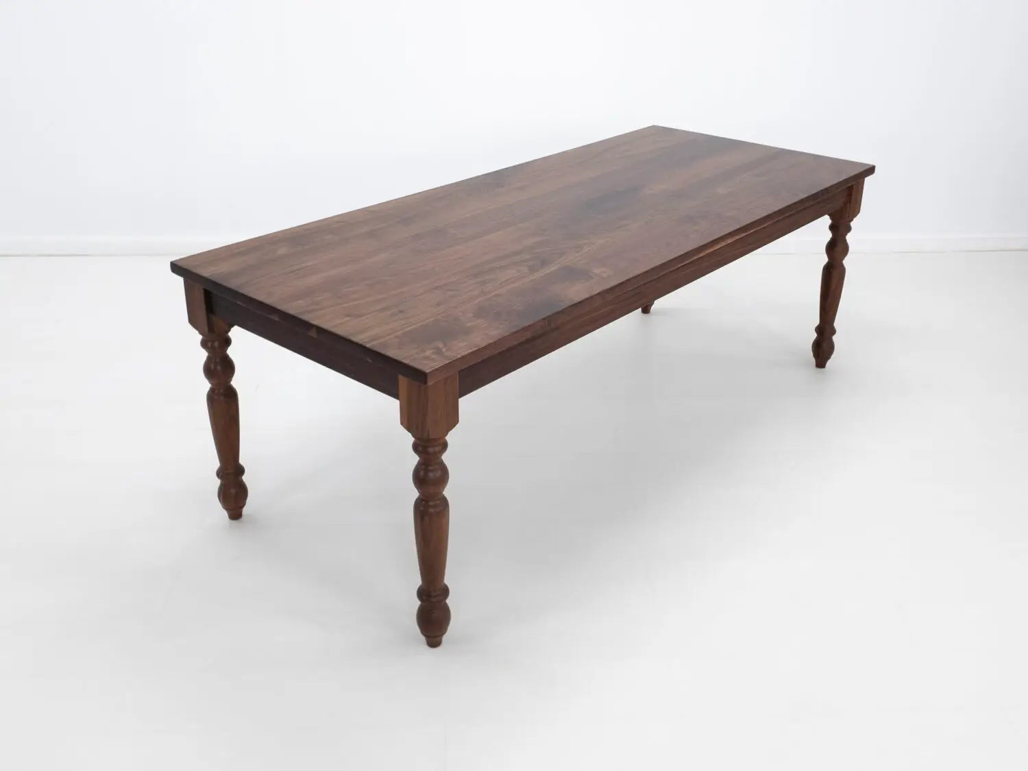 Traditional farmhouse style TESS table with turned legs designed to be a timeless centerpiece in any dining space