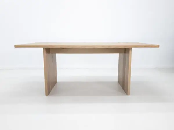 A white oak LILY dining table with a 1.5" thick table top.