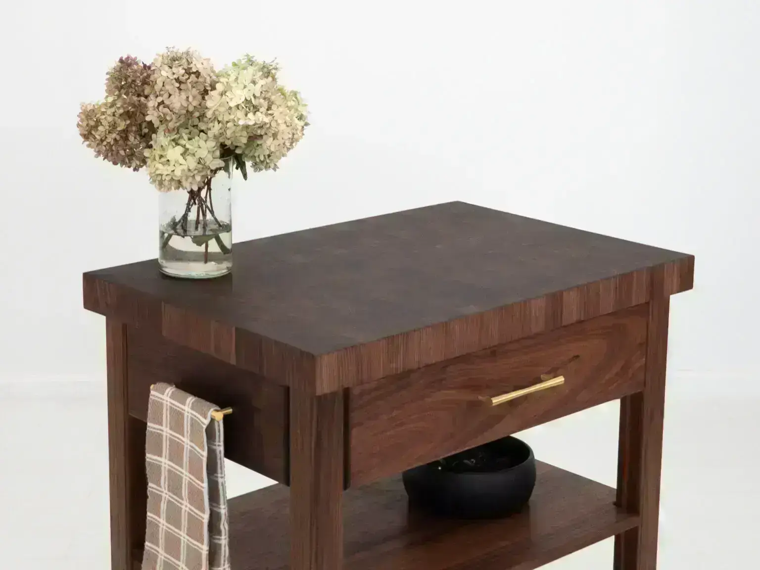 Dark wood kitchen island with drawer