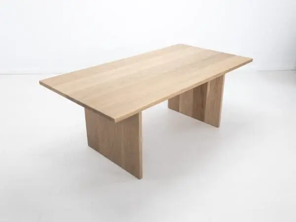 A white oak LILY dining table with a 1.5" thick table top.