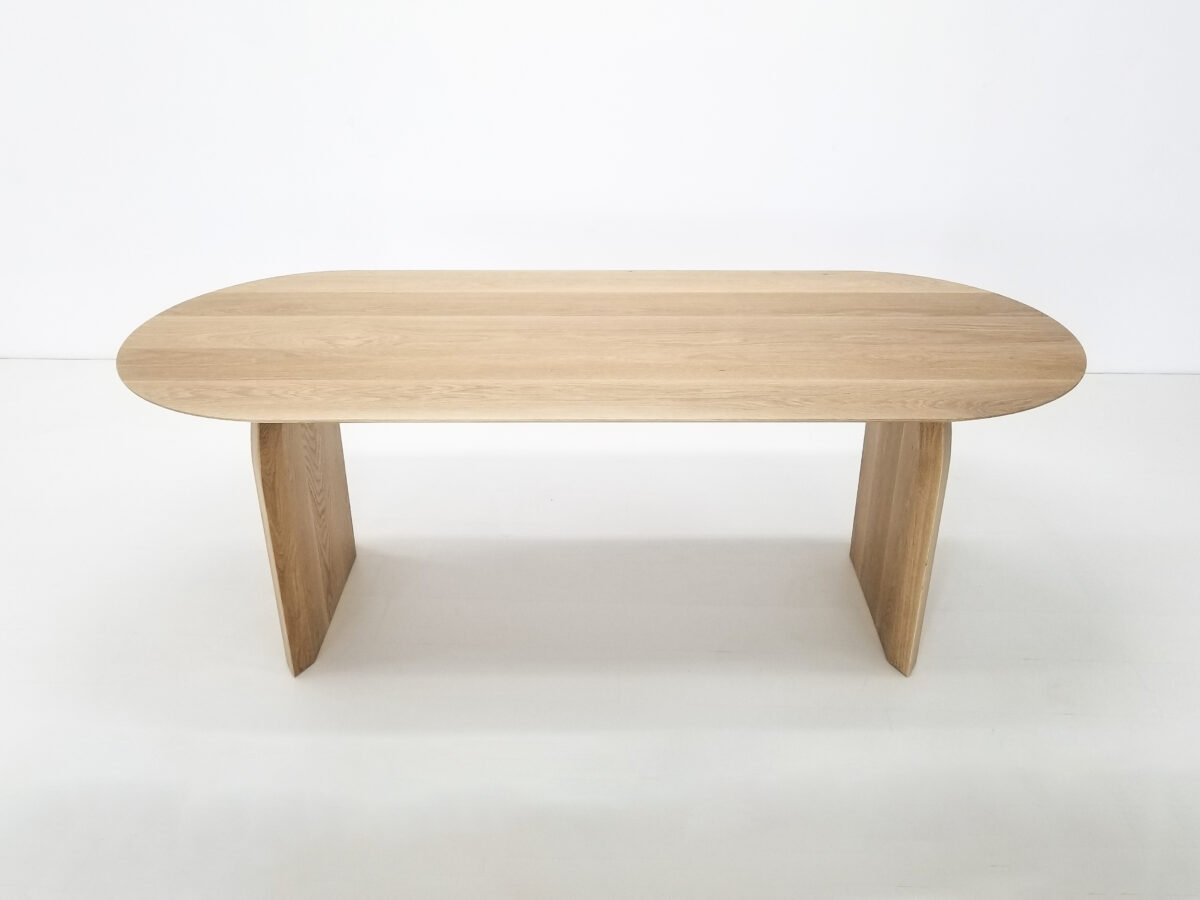 Premium hardwood dining table featuring hand worked curved legs