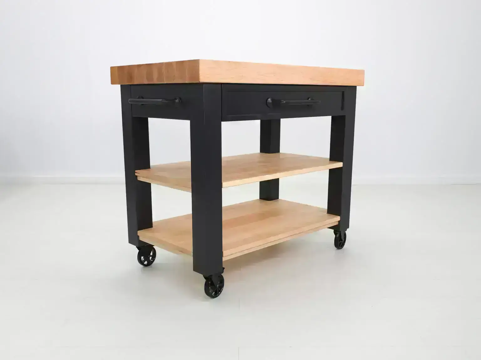 Black kitchen island with wood top