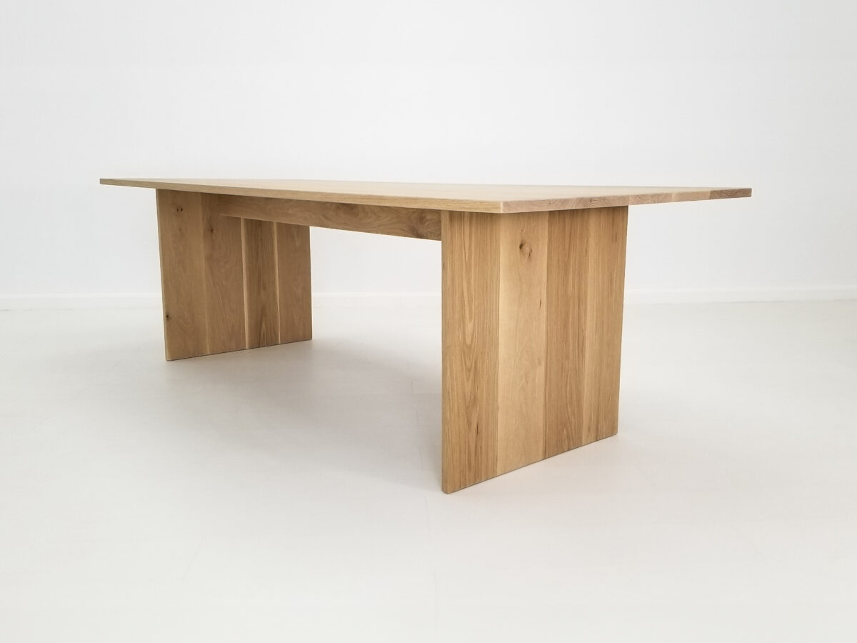 LILY 1 inch dining table in natural white oak with seamless plank top and adjustable leg placement