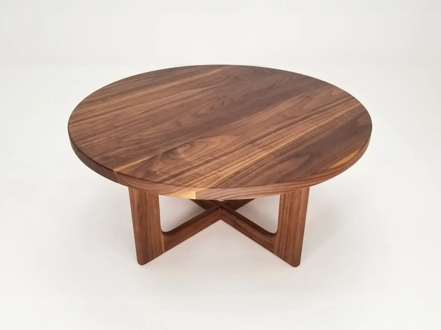 CARY coffee table in solid American hardwood with a 1⅜ inch thick round tabletop and open cross leg base