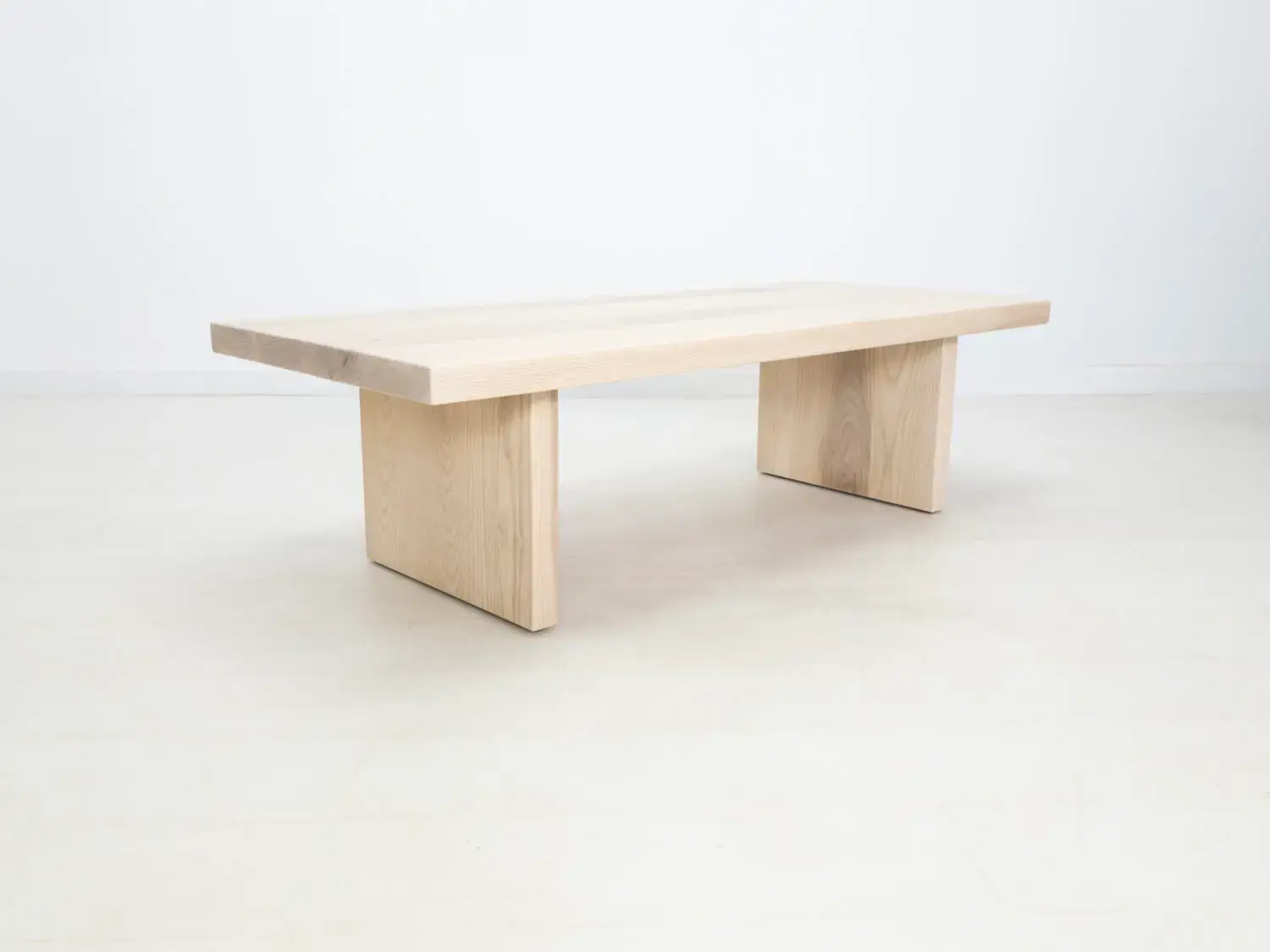 Side view of the LILY coffee table in sunwashed ash showcasing its clean lines and minimalist design