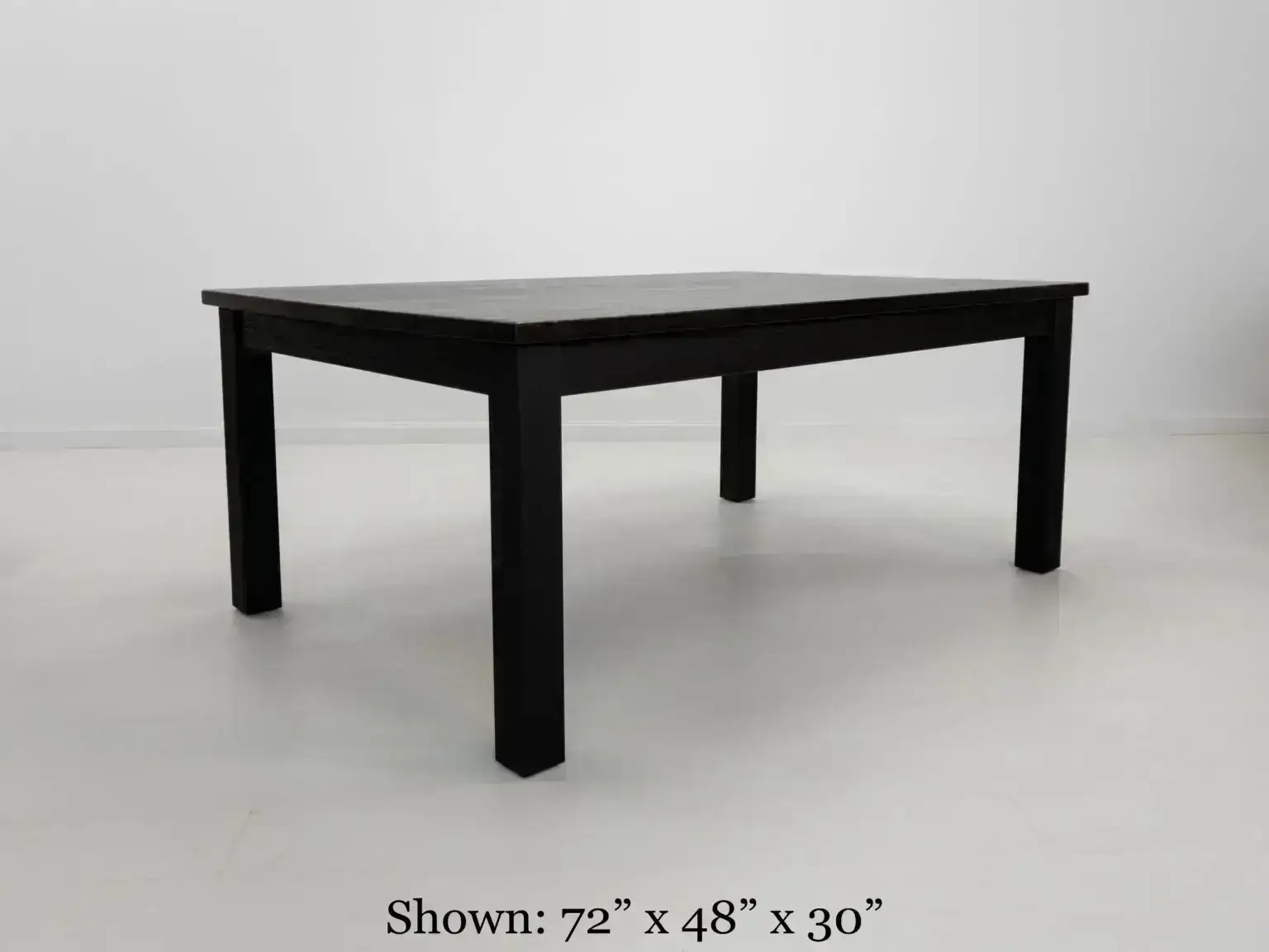 A JONA dining table in blackened ash