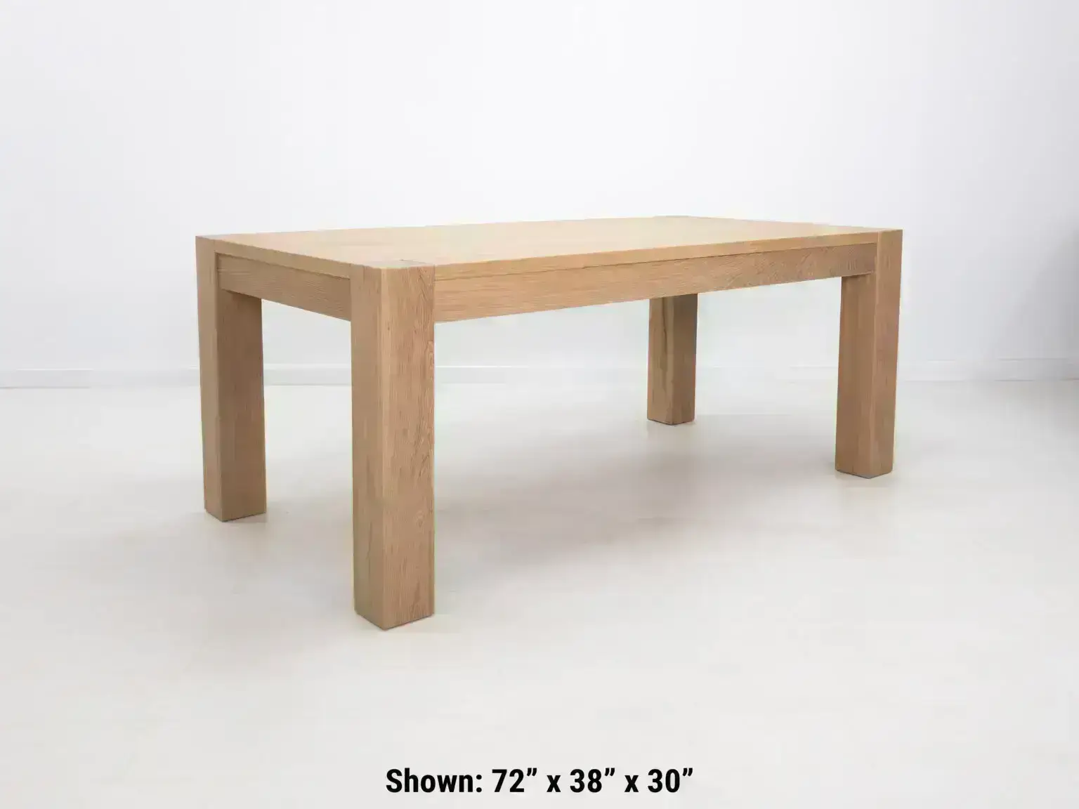 Elegant JAQI dining table in seawashed white oak perfect for modern or coastal interiors