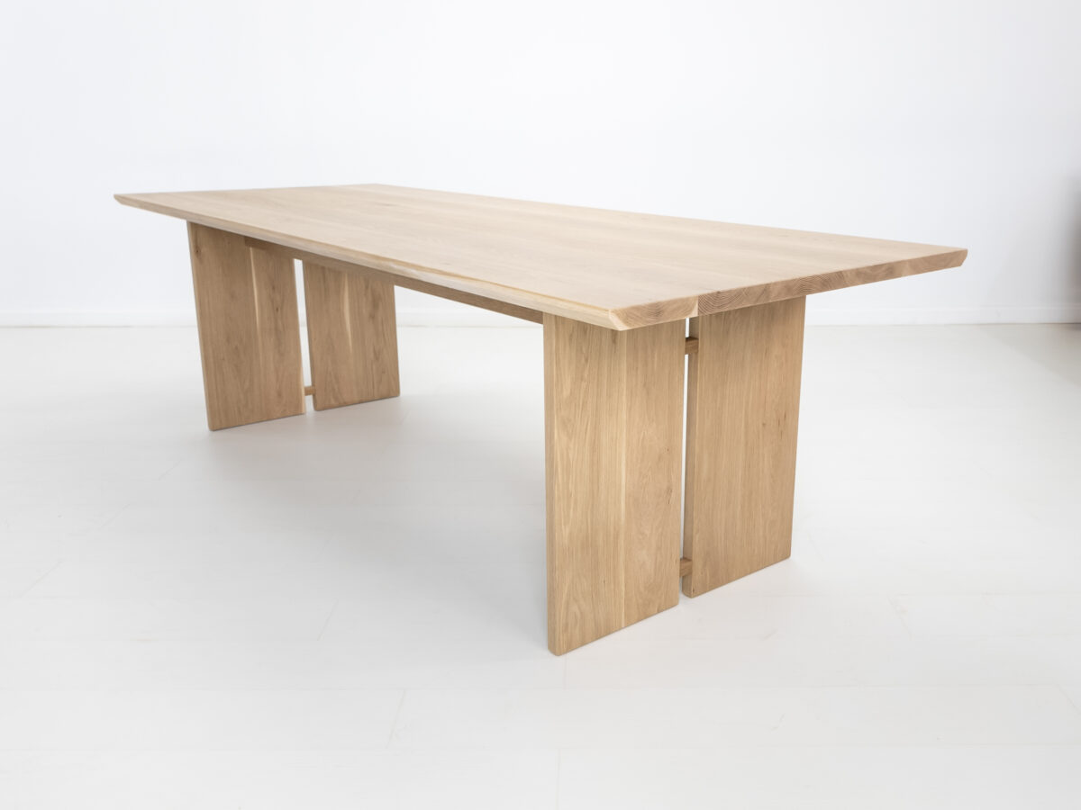 DIVI dining table handcrafted from premium American hardwoods with a 15 inch thick top and unique split leg design