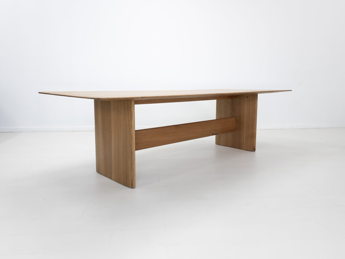 THEO dining table handcrafted from rift sawn white oak with a 1⅜ inch thick under beveled edge tabletop