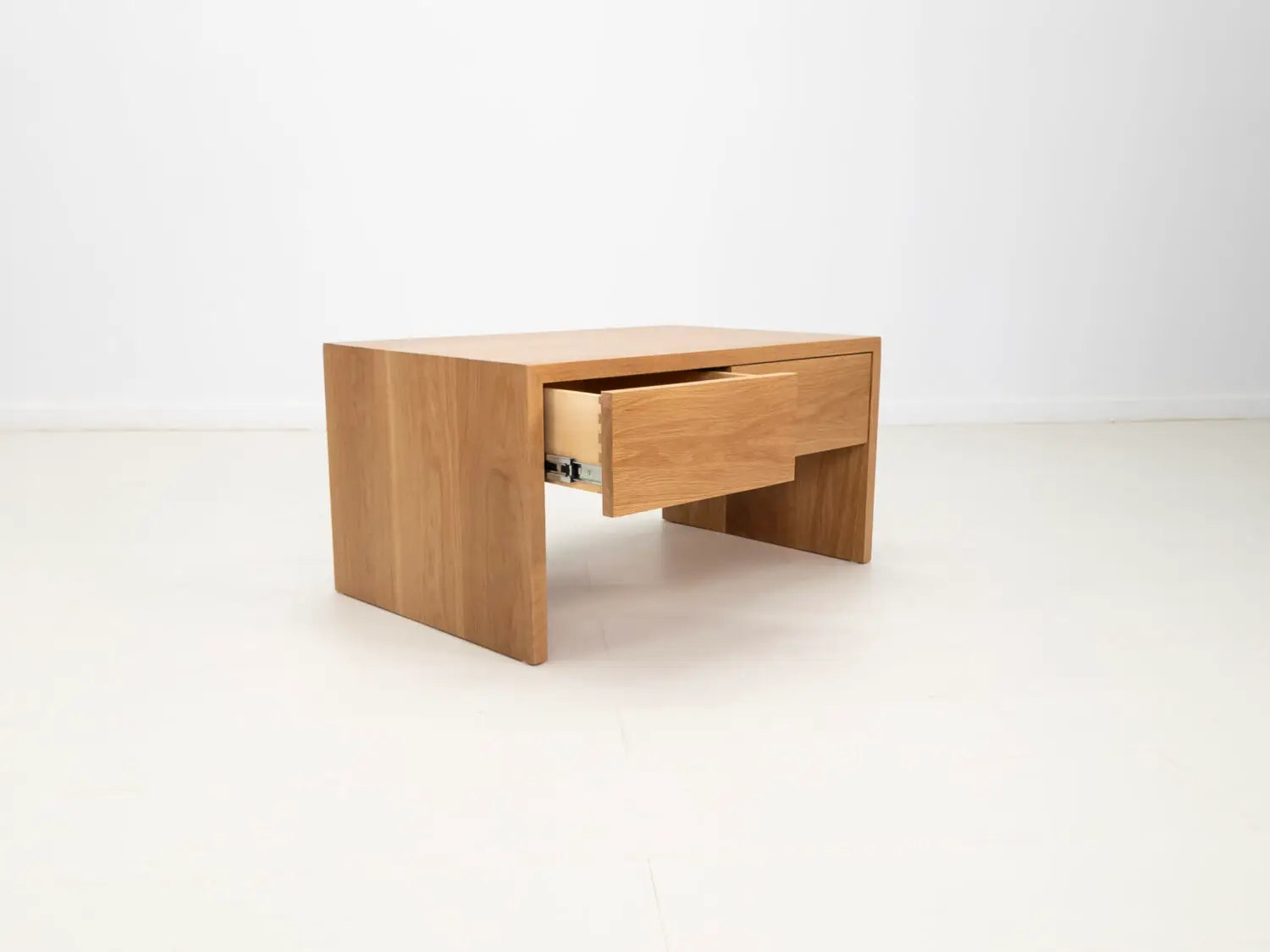 DREW coffee table in natural white oak featuring a seamless grain pattern and modern design