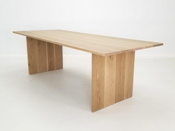 A white oak panel dining table.
