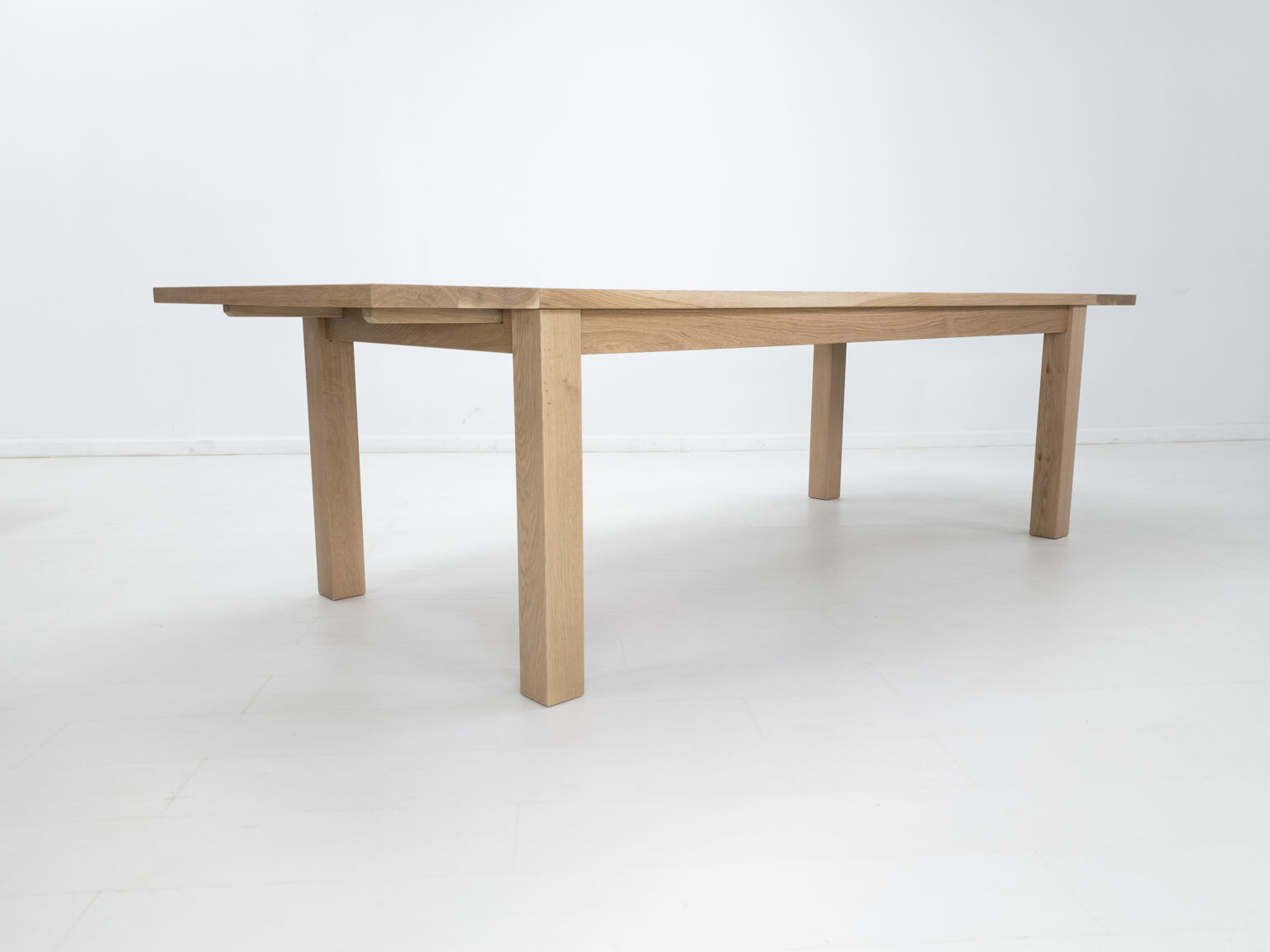 Light oak extending dining table