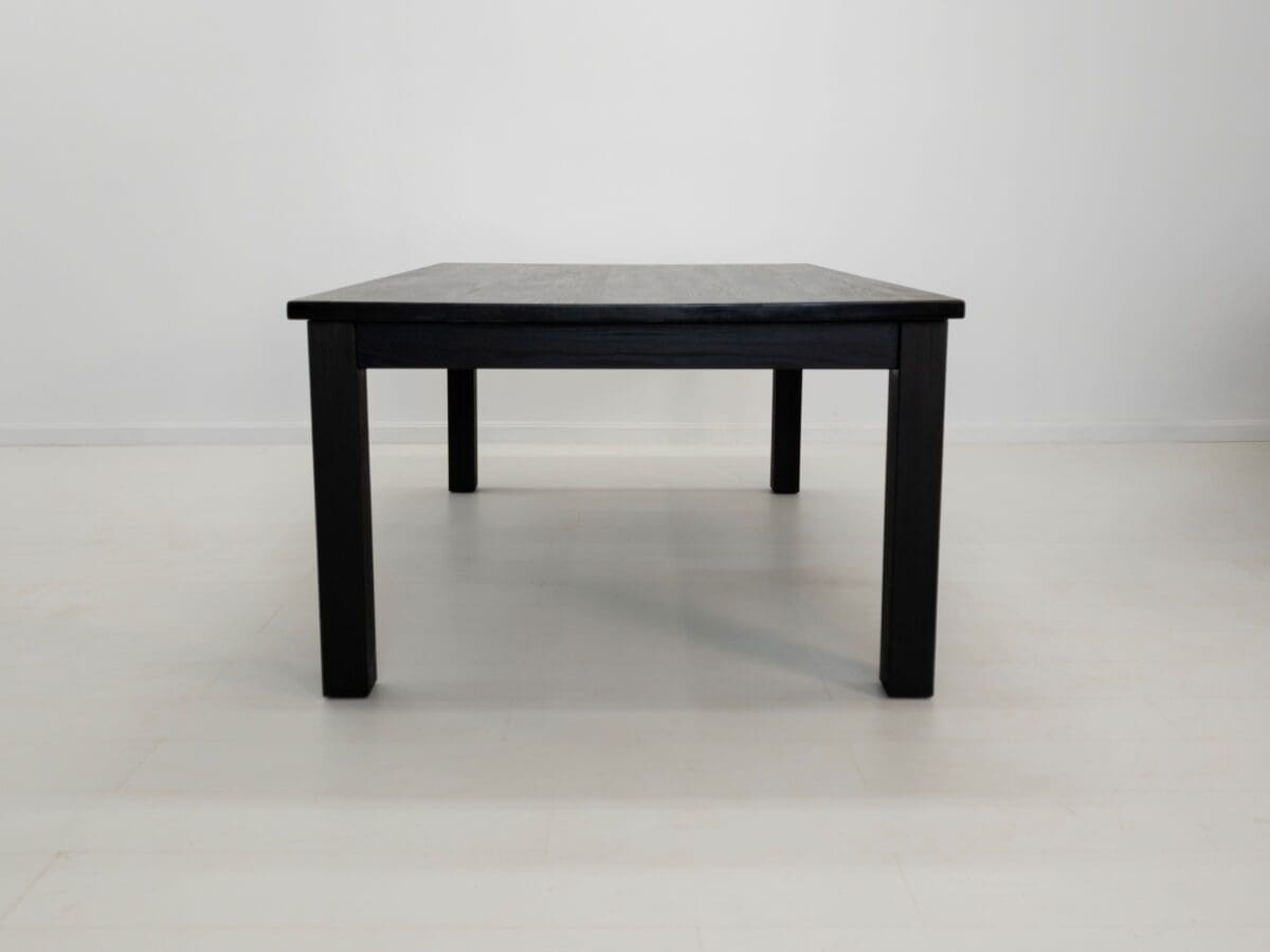 A JONA dining table in blackened ash