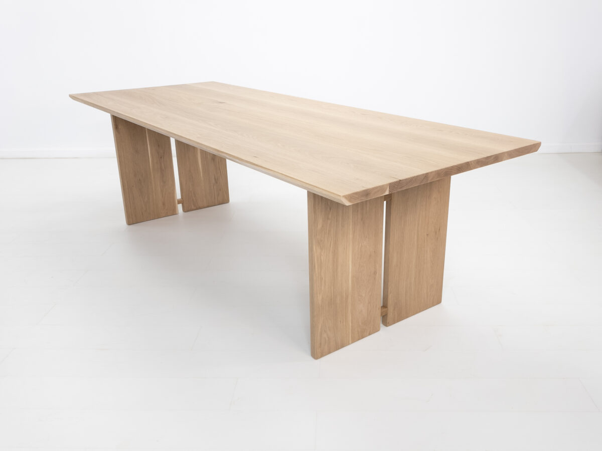 DIVI dining table handcrafted from premium American hardwoods with a 15 inch thick top and unique split leg design