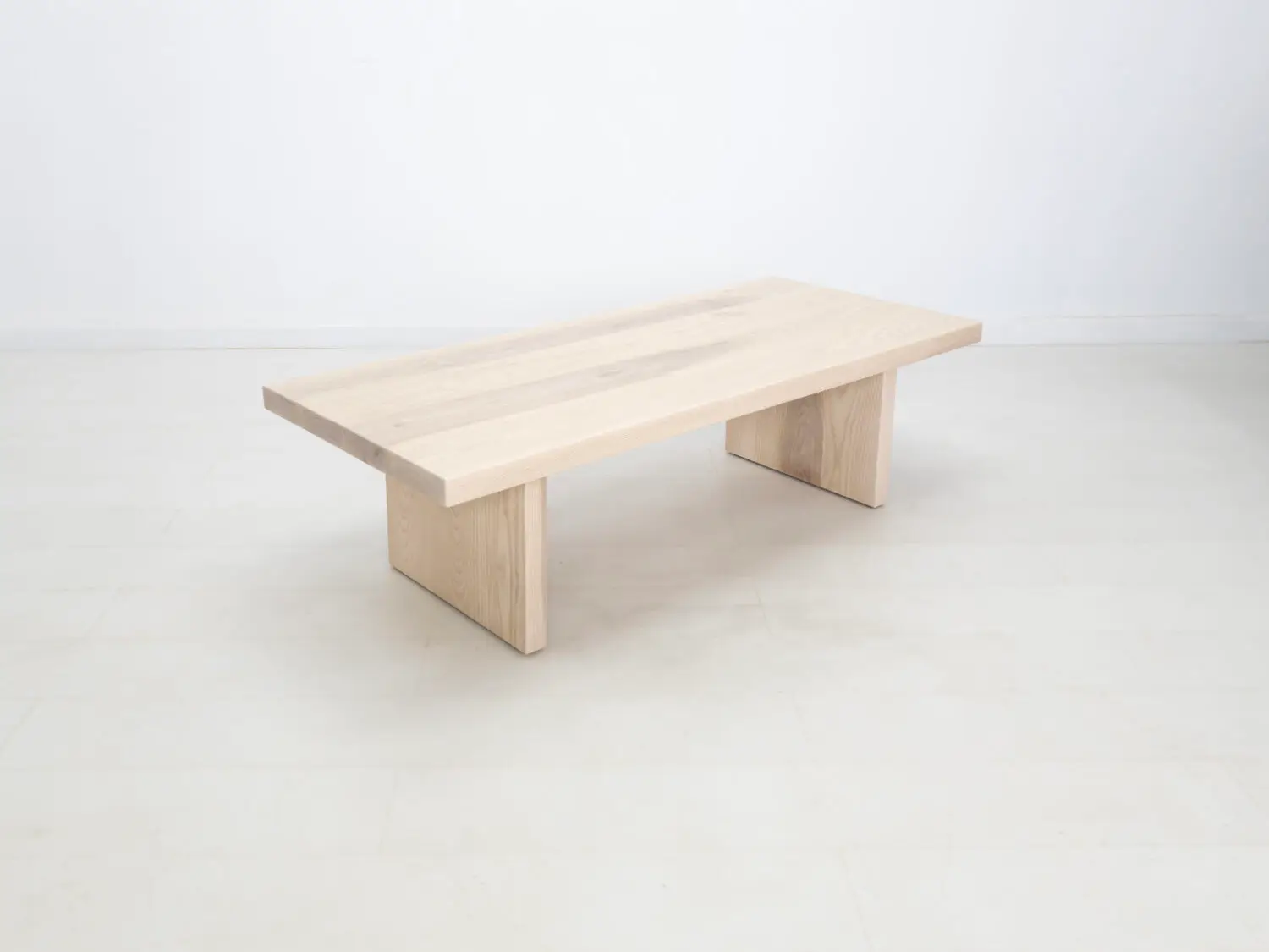 Side view of the LILY coffee table in sunwashed ash showcasing its clean lines and minimalist design