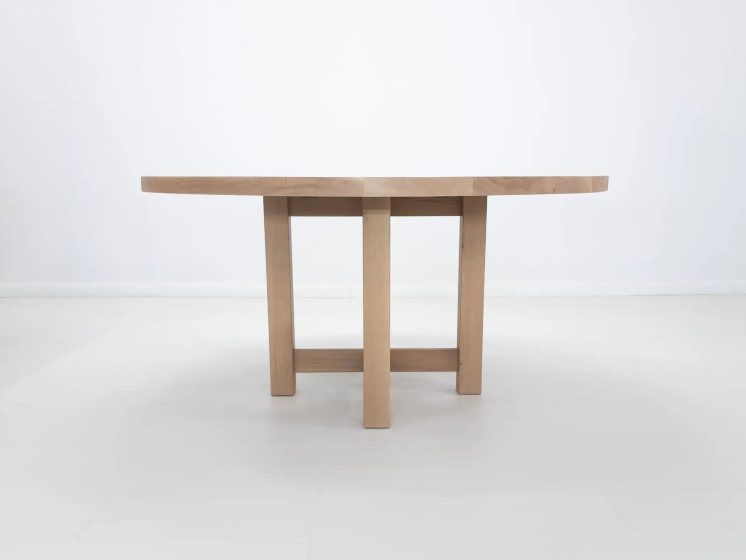 Handmade white oak dining table with a smooth natural finish and rustic charm