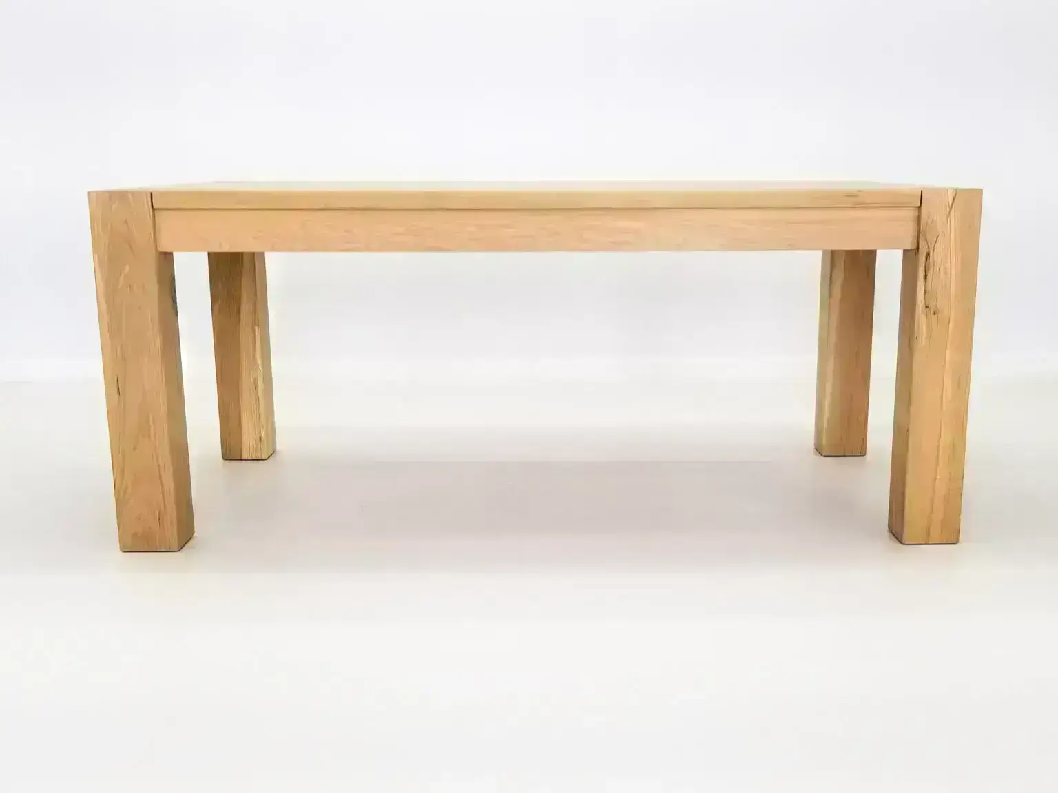 JAQI dining table handcrafted in natural white oak with seamless top and breadboard ends