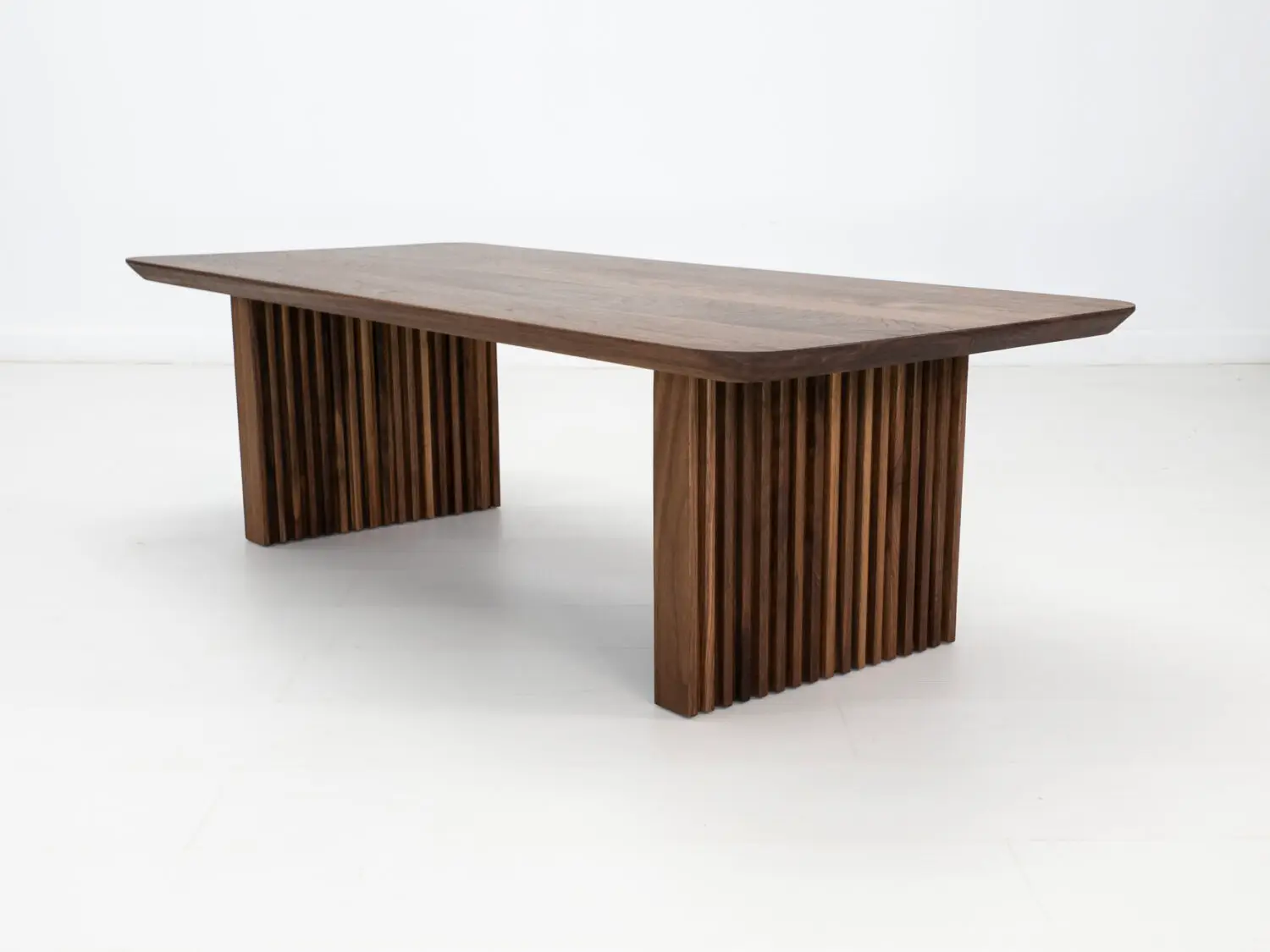 OWEN coffee table in solid walnut with a 1¼ inch thick tabletop and rounded corners