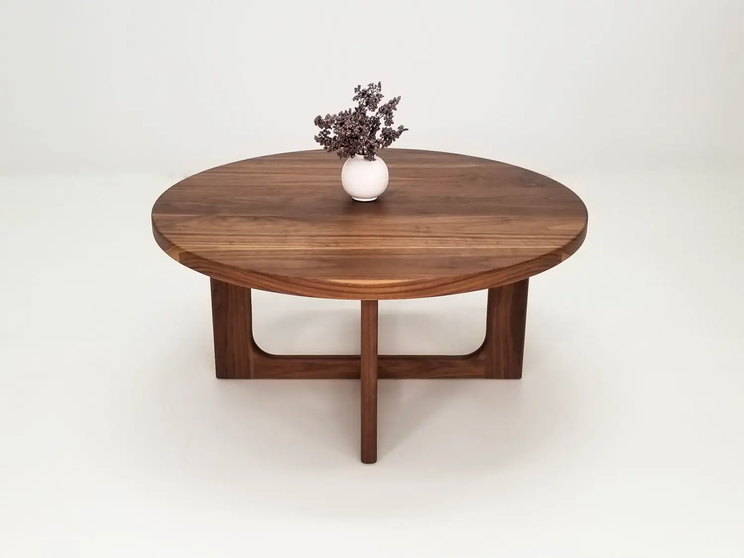 CARY coffee table in solid American hardwood with a 1⅜ inch thick round tabletop and open cross leg base