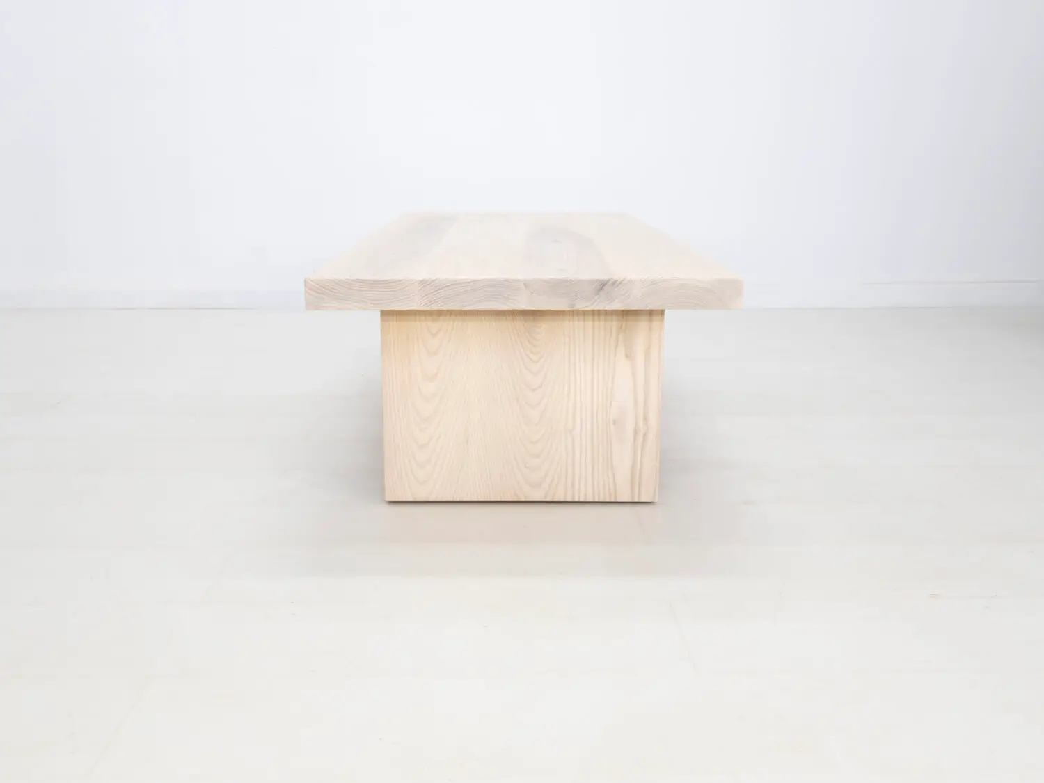 Side view of the LILY coffee table in sunwashed ash showcasing its clean lines and minimalist design