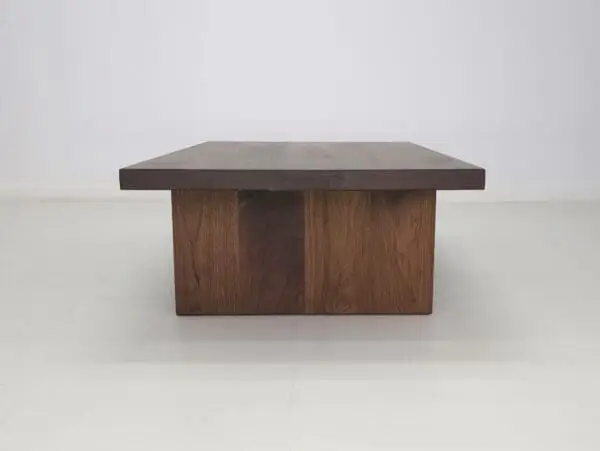 A solid wood coffee table with a dark brown finish.