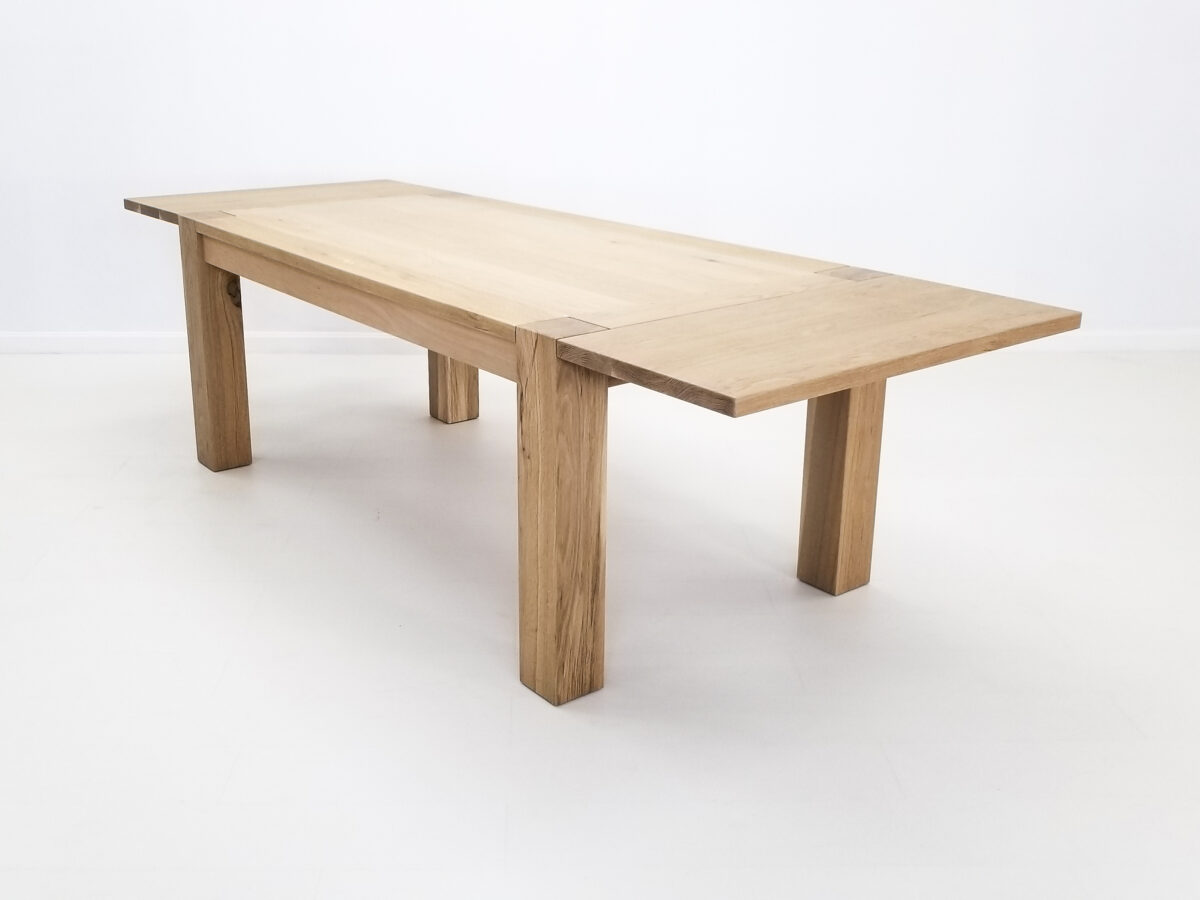 JAQI dining table handcrafted in natural white oak with seamless top and breadboard ends