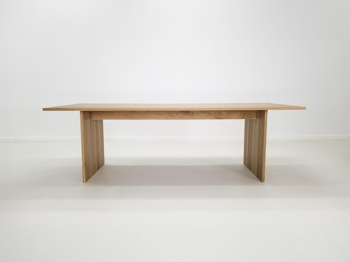 LILY 1 inch dining table in natural white oak with seamless plank top and adjustable leg placement