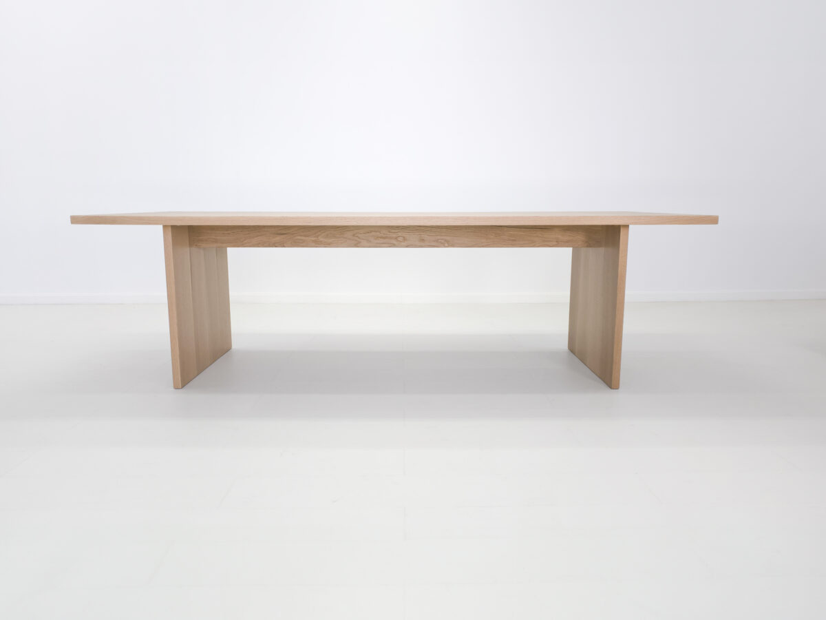Custom LILY table in white oak showcasing its light tones and timeless design