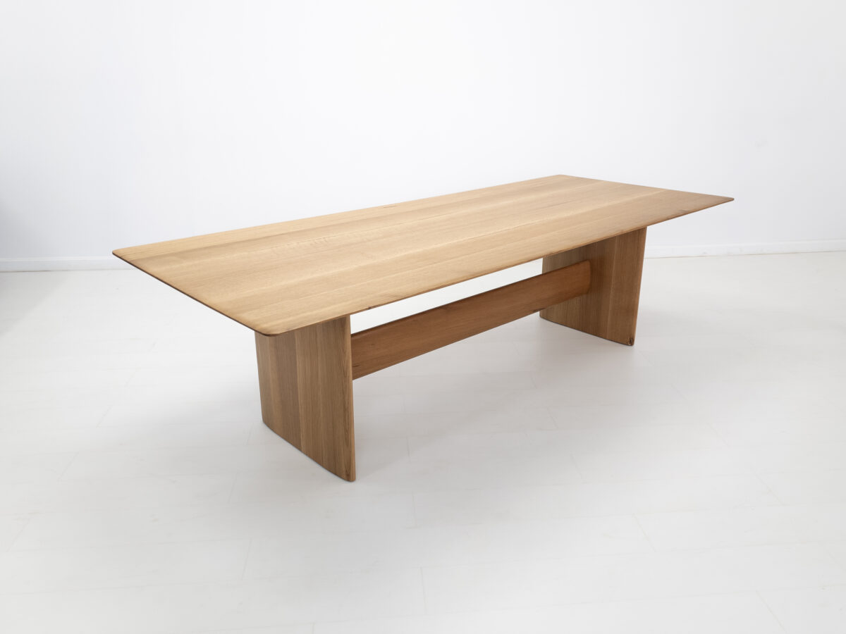THEO dining table handcrafted from rift sawn white oak with a 1⅜ inch thick under beveled edge tabletop