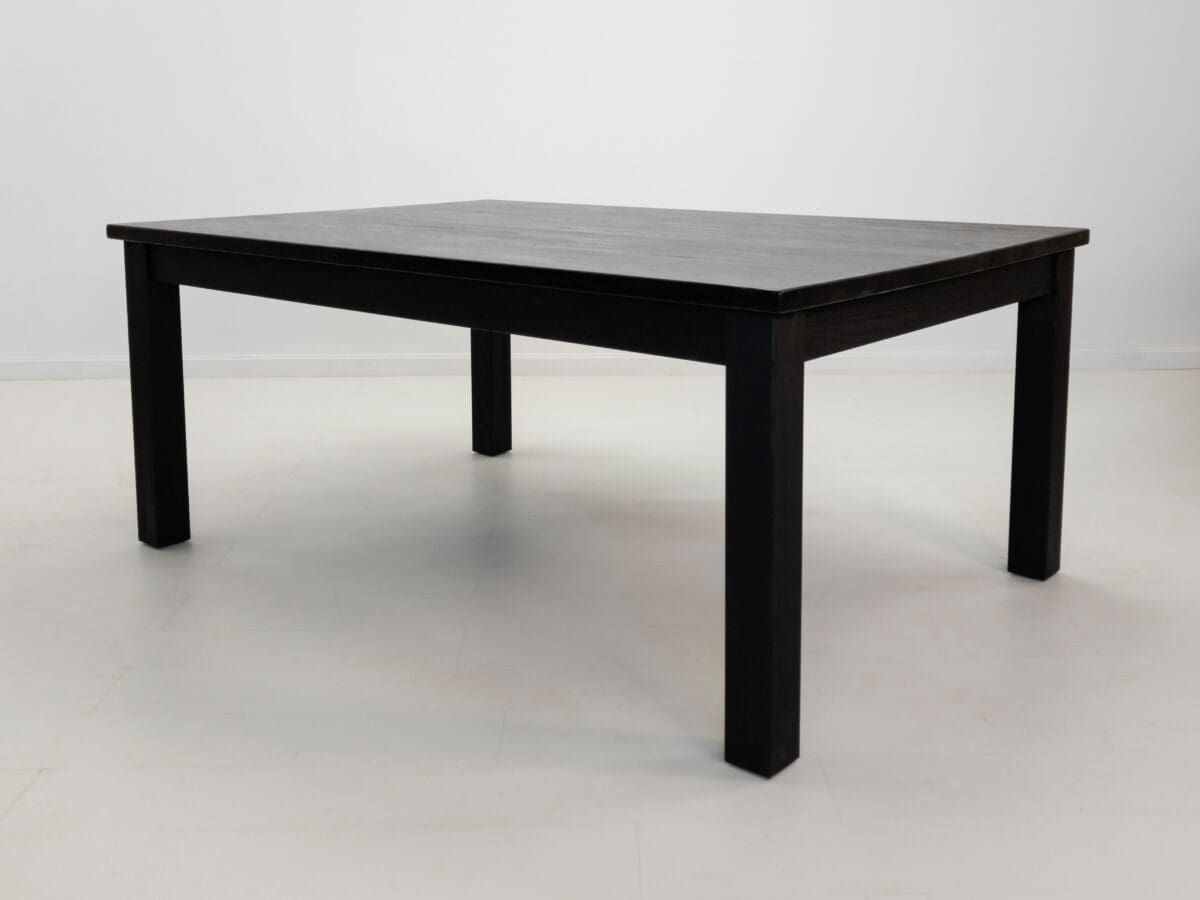 A JONA dining table in blackened ash