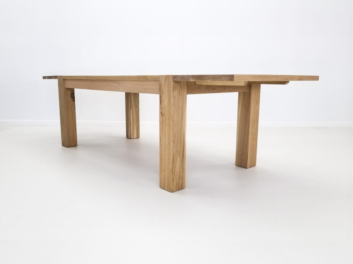 JAQI dining table handcrafted in natural white oak with seamless top and breadboard ends