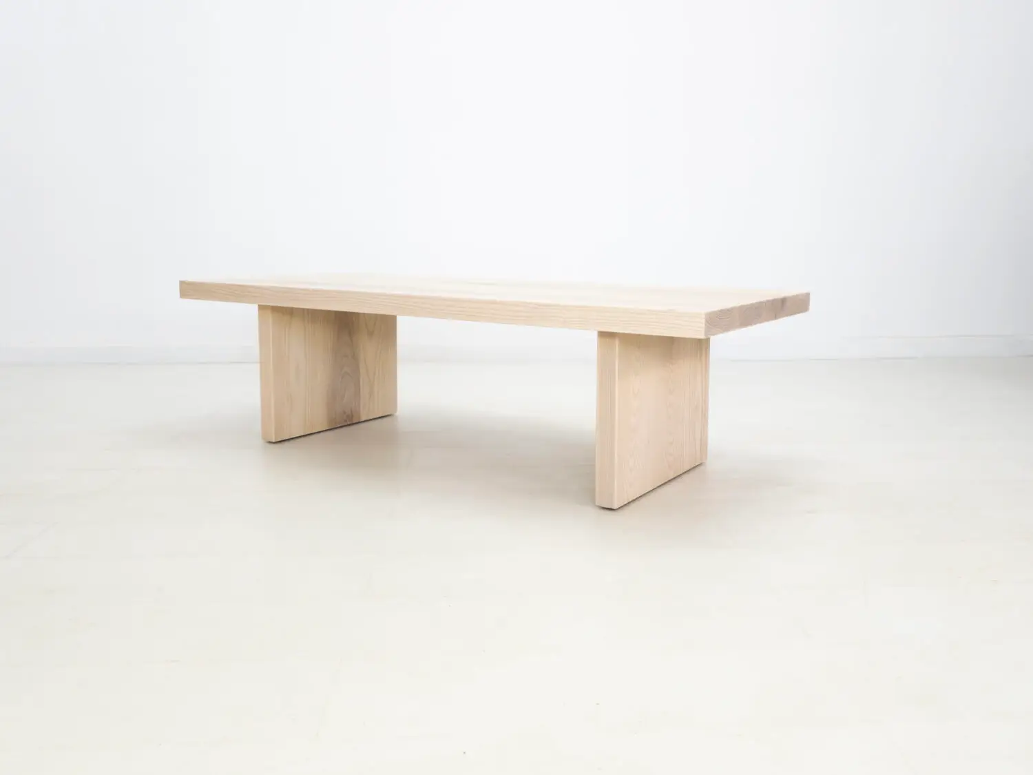 Side view of the LILY coffee table in sunwashed ash showcasing its clean lines and minimalist design