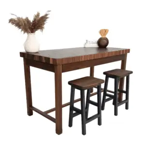 Wooden table with two black stools.