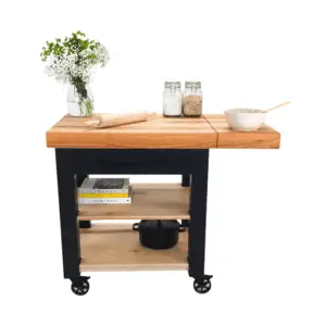 Black kitchen island with wood top and shelves.