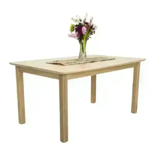 Wooden dining table with flowers and a runner