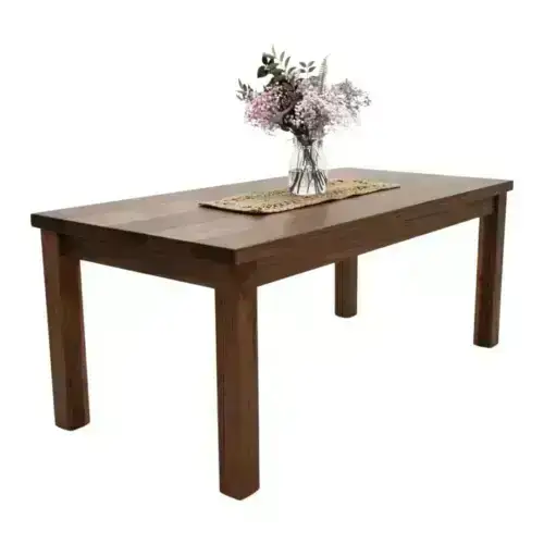 Wooden dining table with flowers on top