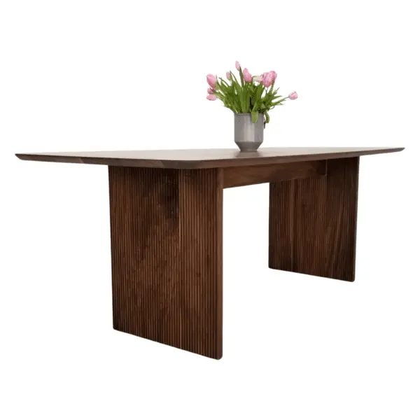 Wooden dining table with grooved legs.