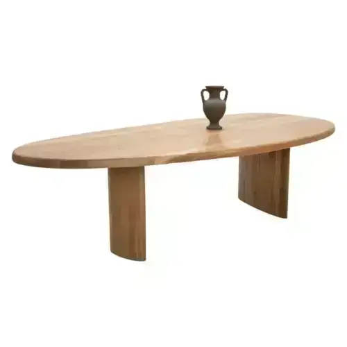 Oval oak dining table with vase.