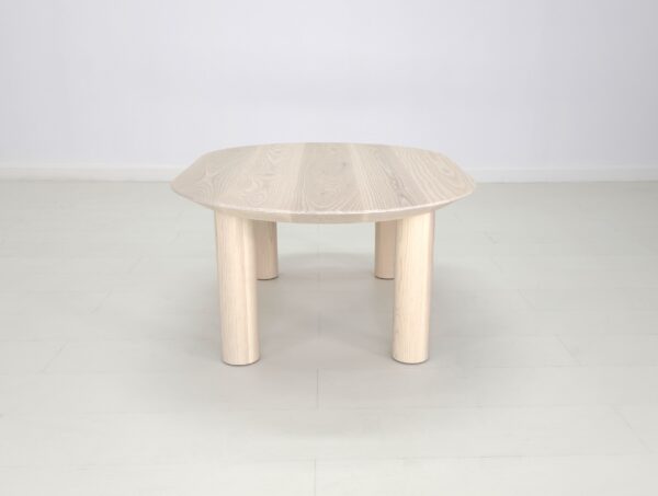 A COVE Coffee Table with a white wooden top and legs.