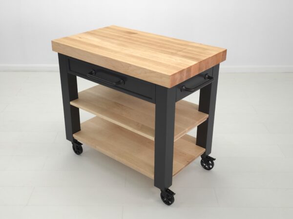 An angled shot of a butcher block kitchen island on wheels.
