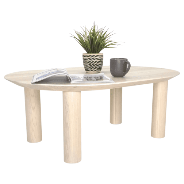 A customized wooden COVE Coffee Table with a plant on top.