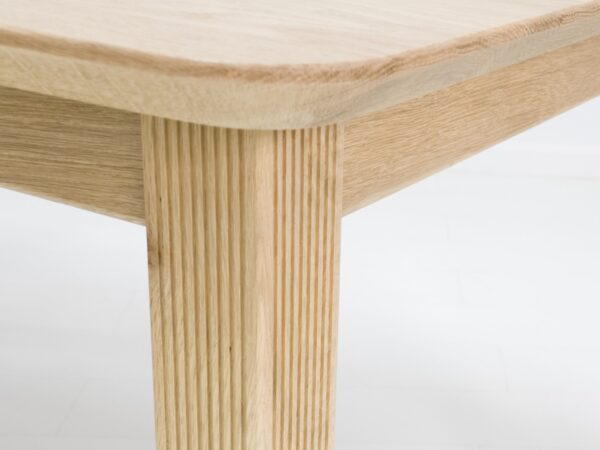 A close up of a ribbed leg in white oak.