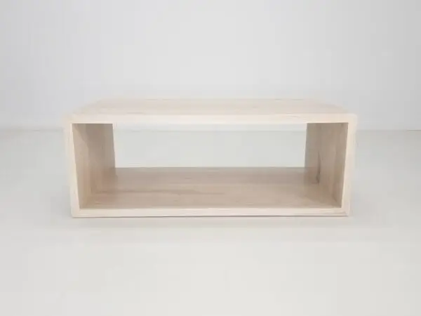 A rectangular coffee table with an open design.