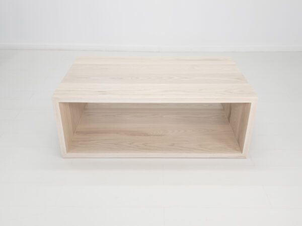 A rectangular coffee table with an open design.
