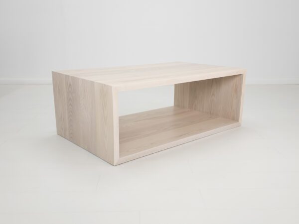 A rectangular coffee table with an open design.