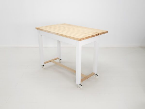 A butcher block kitchen island with room for seating and a drop leaf extension.